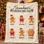 Grandma's Christmas Cookie Crew personalized blanket held up in a Christmas living room