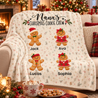 Nana's Christmas Cookie Crew blanket draped on a couch on Christmas morning