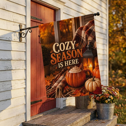 Cozy Season Is Here house flag on a bracket beside a barn-red farmhouse door