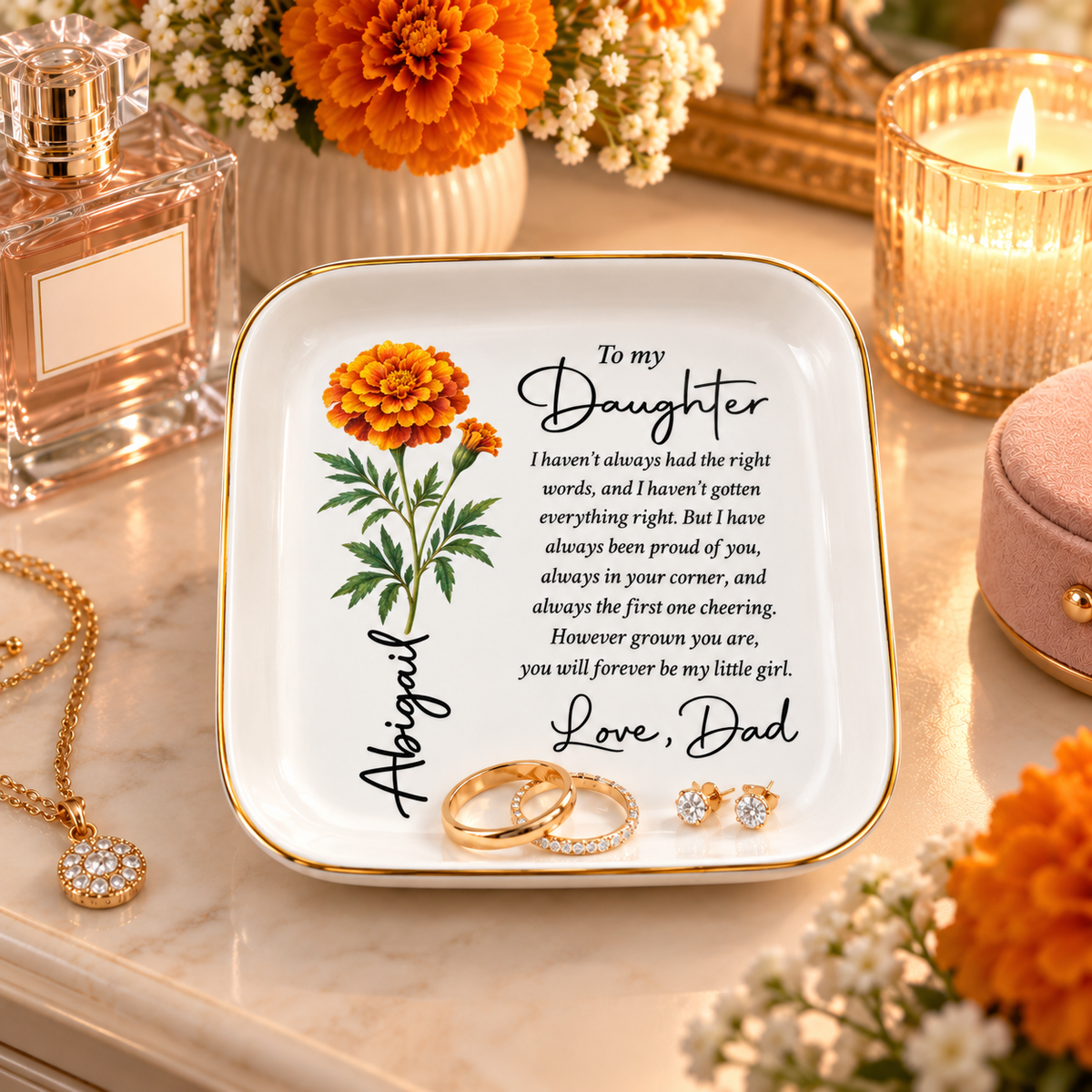Personalized daughter jewelry dish on a vanity with rings and earrings