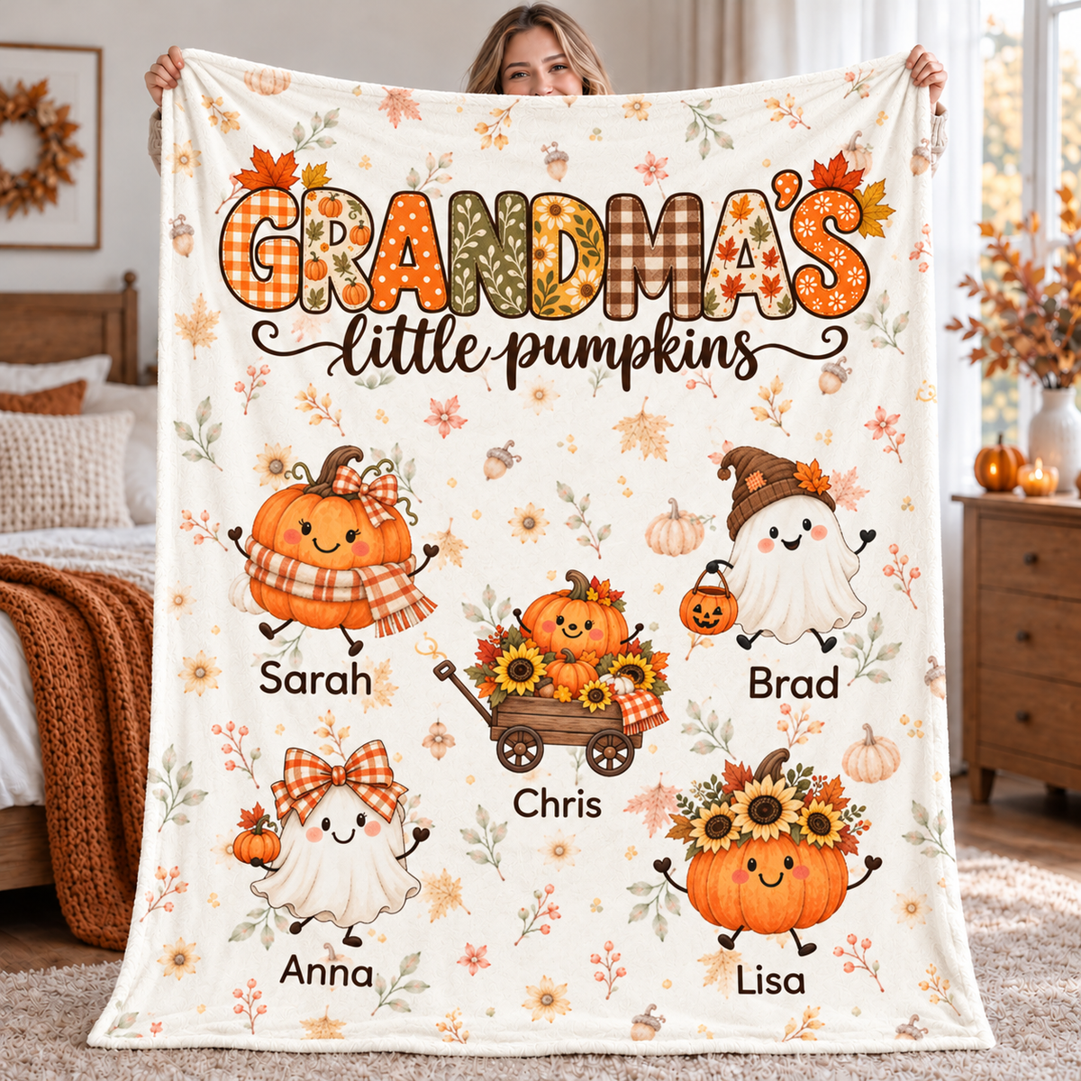 Grandma's Little Pumpkins personalized blanket held up in a cozy fall bedroom, with grandkids' names