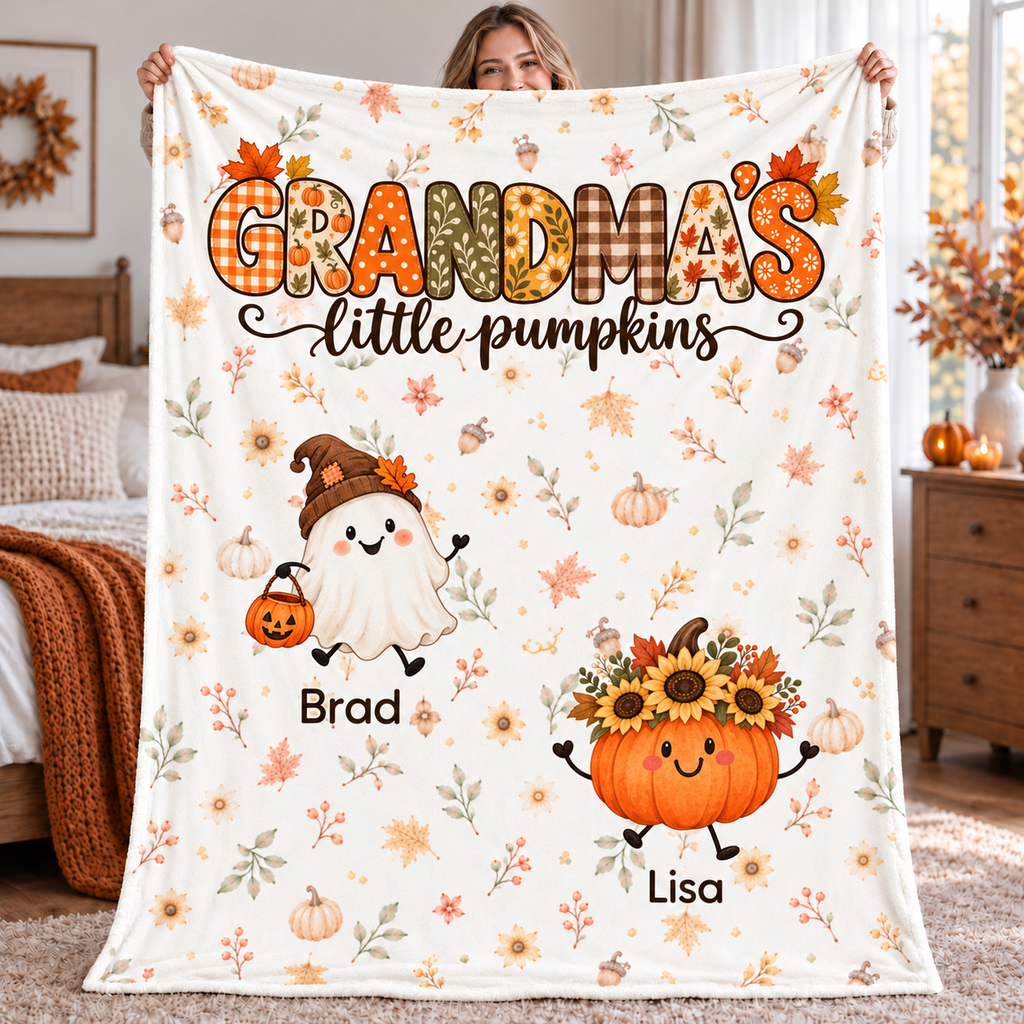 Grandma's Little Pumpkins personalized blanket with 2 grandkids' names, held up in a cozy fall bedroom