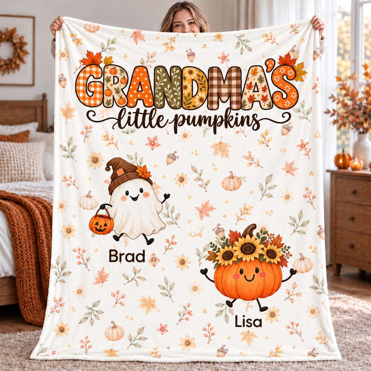 Grandma's Little Pumpkins personalized blanket with 2 grandkids' names, held up in a cozy fall bedroom