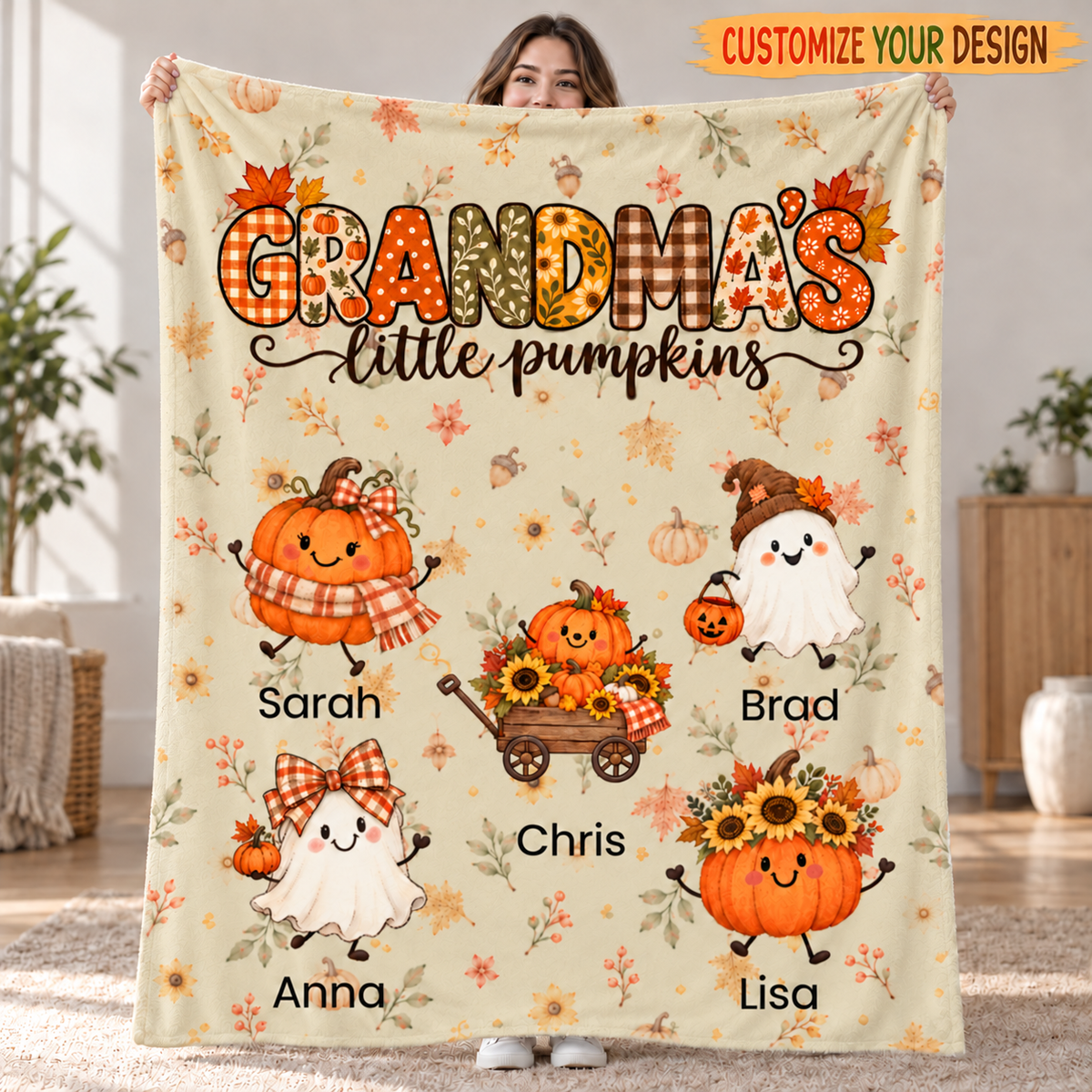Grandma's Little Pumpkins personalized blanket in Tan held up in a living room, with 5 grandkids' names