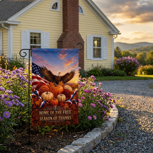 Home of the Free Season of Thanks garden flag outside a butter yellow cottage