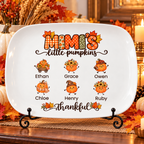 Mimi's Little Pumpkins platter with 6 grandkids' names on a stand on a fall sideboard
