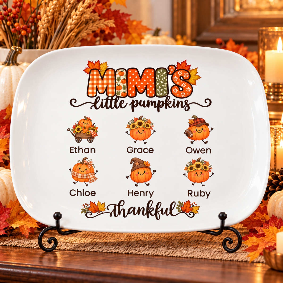 Mimi's Little Pumpkins platter with 6 grandkids' names on a stand on a fall sideboard