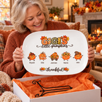 Grandmother unboxing her Gigi's Little Pumpkins platter with display stand in a gift box
