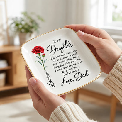 Hand holding the 4.5 inch birth flower jewelry dish to show scale