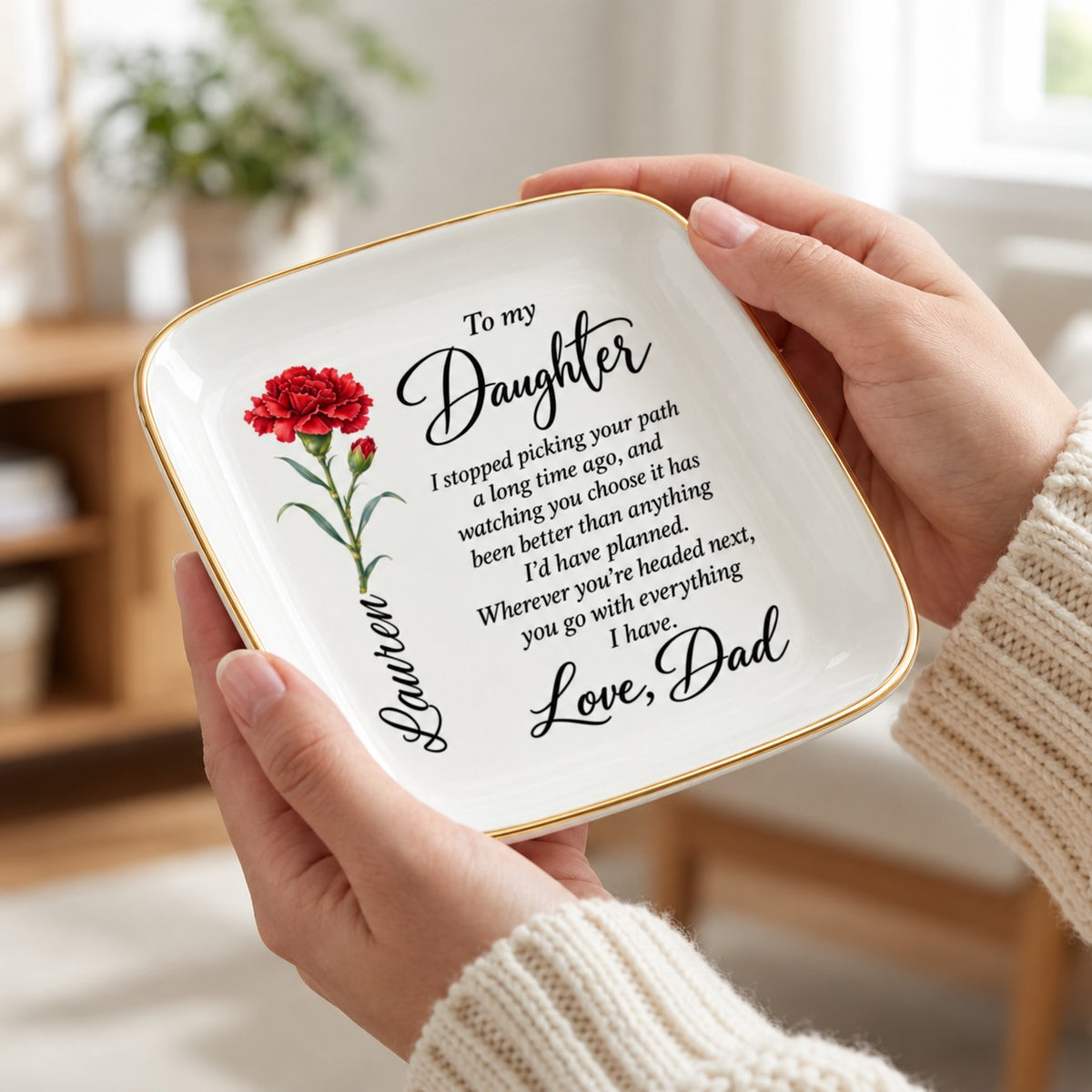 Hand holding the 4.5 inch birth flower jewelry dish to show scale