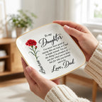 Hand holding the 4.5 inch birth flower jewelry dish to show scale