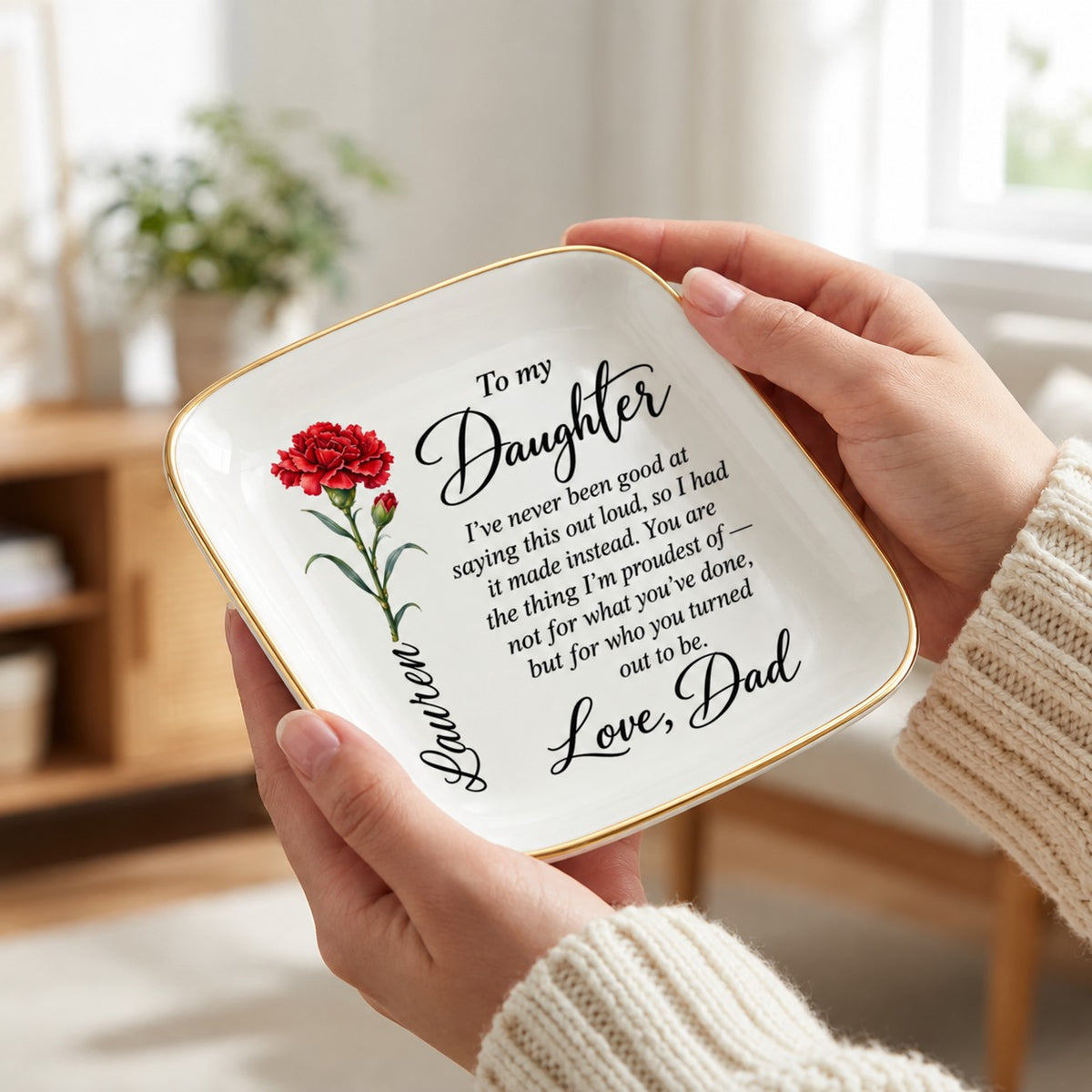 Hand holding the 4.5 inch birth flower jewelry dish to show scale