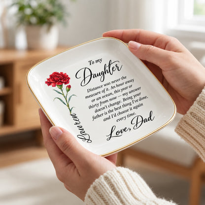 Hand holding the 4.5 inch birth flower jewelry dish to show scale