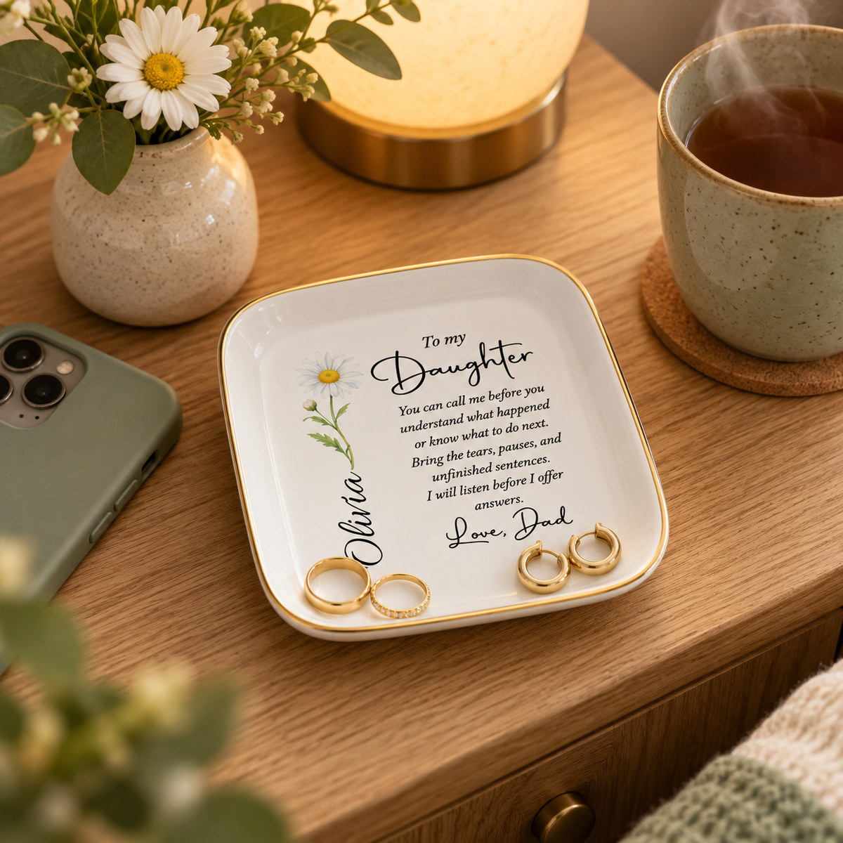 Personalized daughter jewelry dish on nightstand with rings and earrings