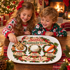 Two kids in Christmas pajamas setting out cookies for Santa on their personalized platter