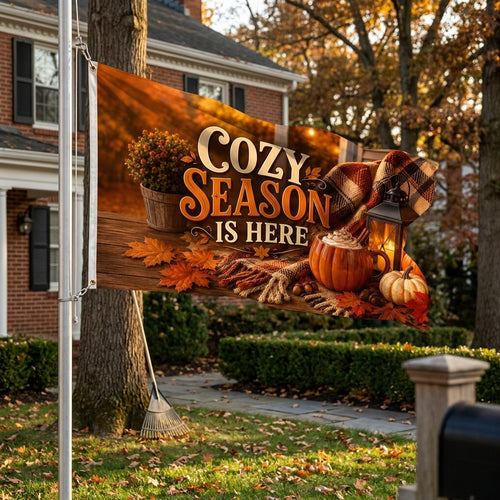 Cozy Season Is Here 3x5 ft fall flag rippling on a flagpole outside a red brick colonial