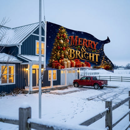 Merry and Bright 3x5 ft Christmas flag rippling on a flagpole outside a navy farmhouse in snow