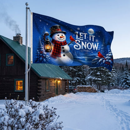 Let It Snow 3x5 ft Christmas flag rippling on a flagpole outside a snowy log cabin
